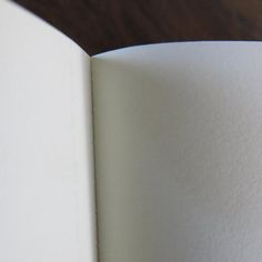 an open book on a wooden table