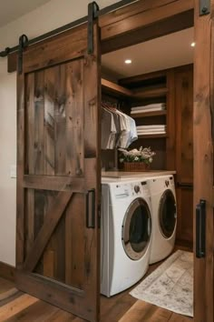 a washer and dryer in a room with wooden doors that open to reveal the laundry