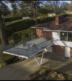 an aerial view of a house with a balcony