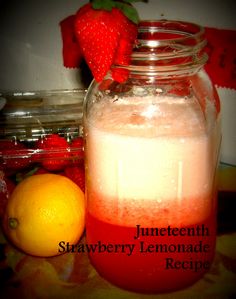 a strawberry lemonade recipe in a mason jar next to a lemon and strawberries