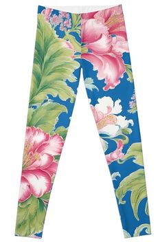 a blue and pink flower print leggings with green leaves on the bottom side