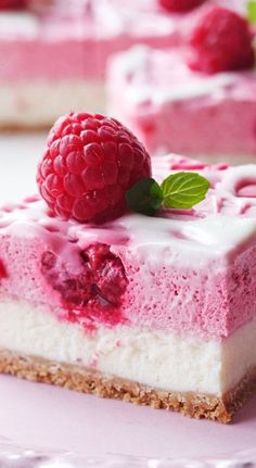 a piece of cheesecake with raspberries on top