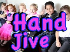 a group of children sitting next to each other with the words hand jive in front of them