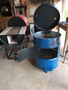 two large blue pots sitting next to each other on top of a table in a room