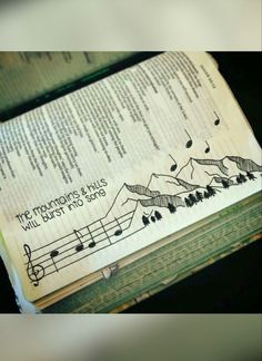 an open book with music notes on it and the words, the mountain this will burst into song