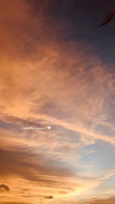 the sky is filled with colorful clouds as the sun sets in the distance behind it