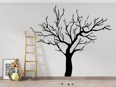 a tree with no leaves is shown in this room