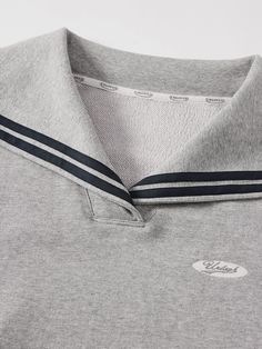 Details: Quiet grey tone navy collar sweatshirt. Embroidery design on the chest, delicate stitching, three-dimensional and delicate Short boxy fit with high-waisted trousers, visually lengthening the proportion. Materials & Care: Polyester 57.4 %, Cotton 33.7%, Viscose 7.4%, Spandex 1.5% Hand wash | Dry clean Do not bleach Size & Fit: Model is 5'7", Bust 32, Waist 24, Hips 35, wearing a size S Item #: JN1SW18 Sporty Relaxed Fit Sweatshirt With Ribbed Collar, Collegiate Relaxed Fit Sweatshirt With Ribbed Cuffs, Navy Sportswear Sweatshirt With Ribbed Cuffs, Luxury Navy Sweatshirt With Ribbed Collar, Navy Sweatshirt With Logo Detail For Streetwear, Sweatshirt Embroidery, Collar Sweatshirt, Denim Jean Dress, Chic Business Casual