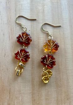 An autumnal earring set decorated with gold charms and  maple leaf charms. Doll Jewelry, Gold Charms, Fall Jewelry, Leaf Charms, Leaf Earrings, Gold Charm, Maple Leaf, Doll Toys, Earring Set