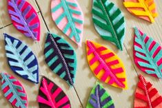 colorful felt leaves laid out on a table