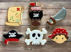 decorated cookies with pirate theme on wooden table