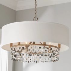 a chandelier hanging from a ceiling in a room