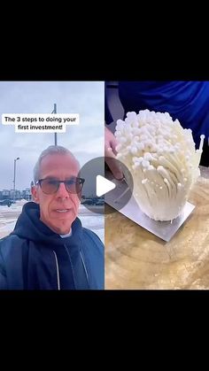 a man in sunglasses standing next to a cake on top of a wooden cutting board