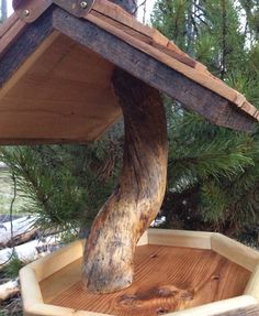 a bird house built into the side of a tree