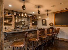 a bar with several stools in front of it