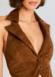 Our Josephine Suede Vest is a luxurious and stylish piece that is perfect for adding a touch of elegance to any outfit. The rich suede fabric and flattering silhouette create a look that is both chic and timeless, shown here in Cinnamon. 100% Goat Leather Made in India Model is 5'10" wearing size S Style No. FW24-10113 Lace Up Vest, Suede Set, Bridal Reception Dress, Faux Suede Vest, Suede Top, Corporate Chic, Bride Bachelorette, Bachelorette Party Bride, Suede Vest