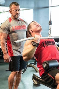 a man is doing squats with a barbell