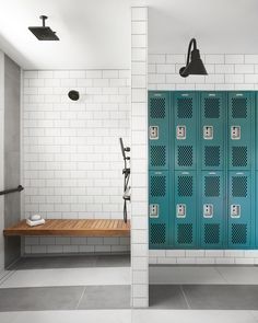 the lockers in the bathroom are painted teal