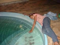 a woman laying on top of an inflatable pool