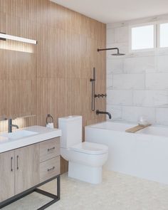 a bathroom with two sinks, a toilet and a bathtub next to each other