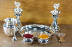 silver plated items displayed on wooden table top