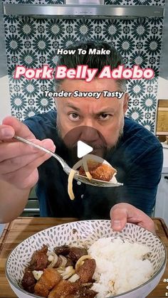 a man holding a spoon over a bowl of food with rice and meat on it