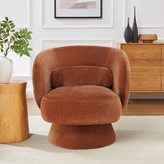 a brown chair sitting on top of a white rug next to a potted plant