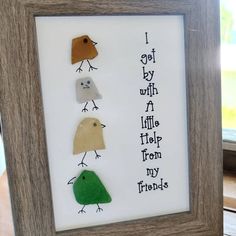 three little birds in a frame with words written on the bottom and one small bird below