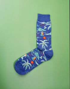 Providing the same feel of day relaxing or soaking up sun rays at the beach, these Beach Day Crew Socks serve as an ideal choice of footwear for any casual or vacation outing. The unique and vibrant pattern, depicting beach scenes such as waves, surfing, an umbrella and the sun, completes the look and makes a perfect casual sock for any beach our outdoor enthusiast. We all wish we could be at the beach at all times and these blue crew socks for men are the next best thing! Take your feet on a va Casual Multicolor Summer Socks, Casual Multicolor Socks For Summer, Fun Multicolor Summer Socks, Green Summer Socks, Casual Blue Outdoor Socks, Casual Blue Socks For Outdoor, Casual Cotton Summer Socks, Blue Cotton Socks For Summer, Green Cotton Summer Socks