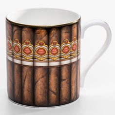 a coffee cup with cigars painted on it