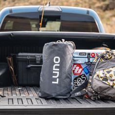 the back end of a pickup truck filled with items