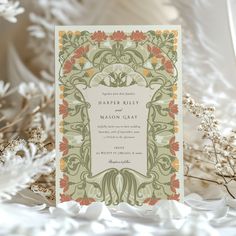 a wedding card with an ornate design on it