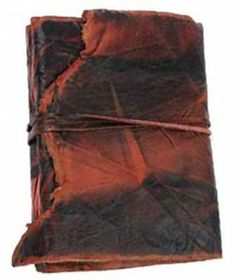 an old book is wrapped in brown paper