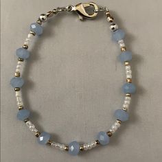 Handmade By Me, A Blue, White And Gold Small Bead Bracelet Accented In Silver. Bracelet Is 6 3/4” Long. Coastal Grandmother Aesthetic Jewelry, Blue And Silver Beaded Bracelets, Gold And Silver Beaded Bracelets, Concert Bead Bracelets, A Bracelet Handmade, Blue And White Seed Bead Bracelet, Cute Blue Bracelet Ideas, Black White Beaded Bracelet, Basic Beaded Bracelet