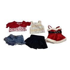 four different outfits for dolls including a santa hat, skirt and boots on a white background