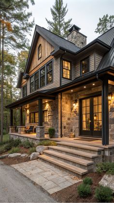 a large house with stone steps leading up to it