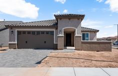 a house with a driveway in front of it