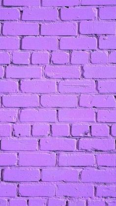 a pink brick wall that has been painted