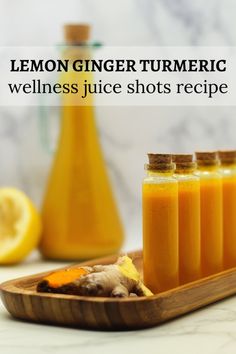 lemon ginger turmerice juice shots recipe on a tray with sliced lemons