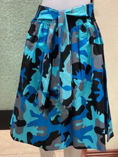 A cool and classy fun camouflage broomstick skirt . This skirt is Endless possibilities: Order yours today. visit evelyncreation.com African Skirt, Broomstick Skirt, Camo Skirt, African Skirts, Blue Camouflage, Elastic Waist Skirt, Blue Camo, Skirt With Pockets, Skirts With Pockets