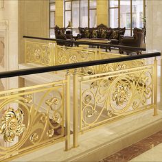 an ornately designed balcony railing in a hotel lobby