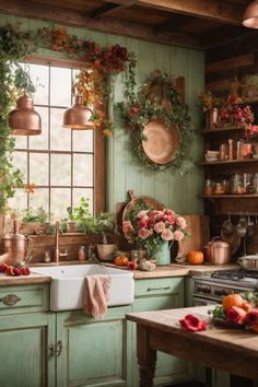 a kitchen filled with lots of green cabinets and flowers on the windowsill, potted plants hanging over the sink