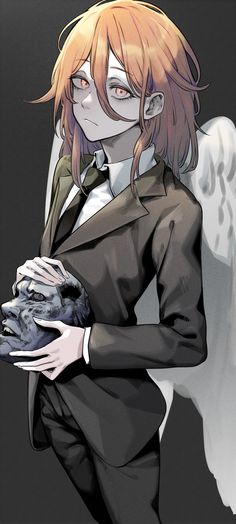 a woman in a suit holding an animal