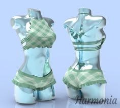 two mannequins are dressed in green and white plaid fabric, one is wearing a skirt