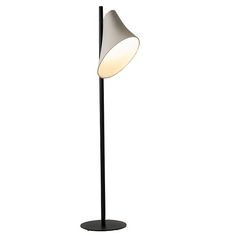 a black floor lamp with a white light on the top and bottom part of it