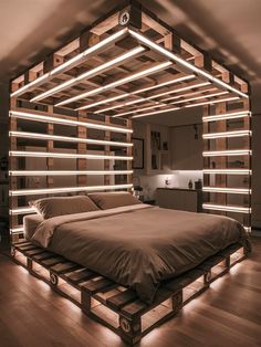 a bed made out of pallets with lights on each side