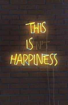 this is my happiness neon sign on a brick wall