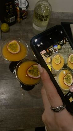 someone taking a photo of some food on their cell phone