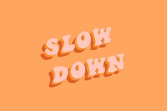 the words slow down are shown in pink and orange letters on an orange background,