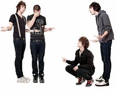 three young men standing next to each other in front of a white background, one holding his hands out